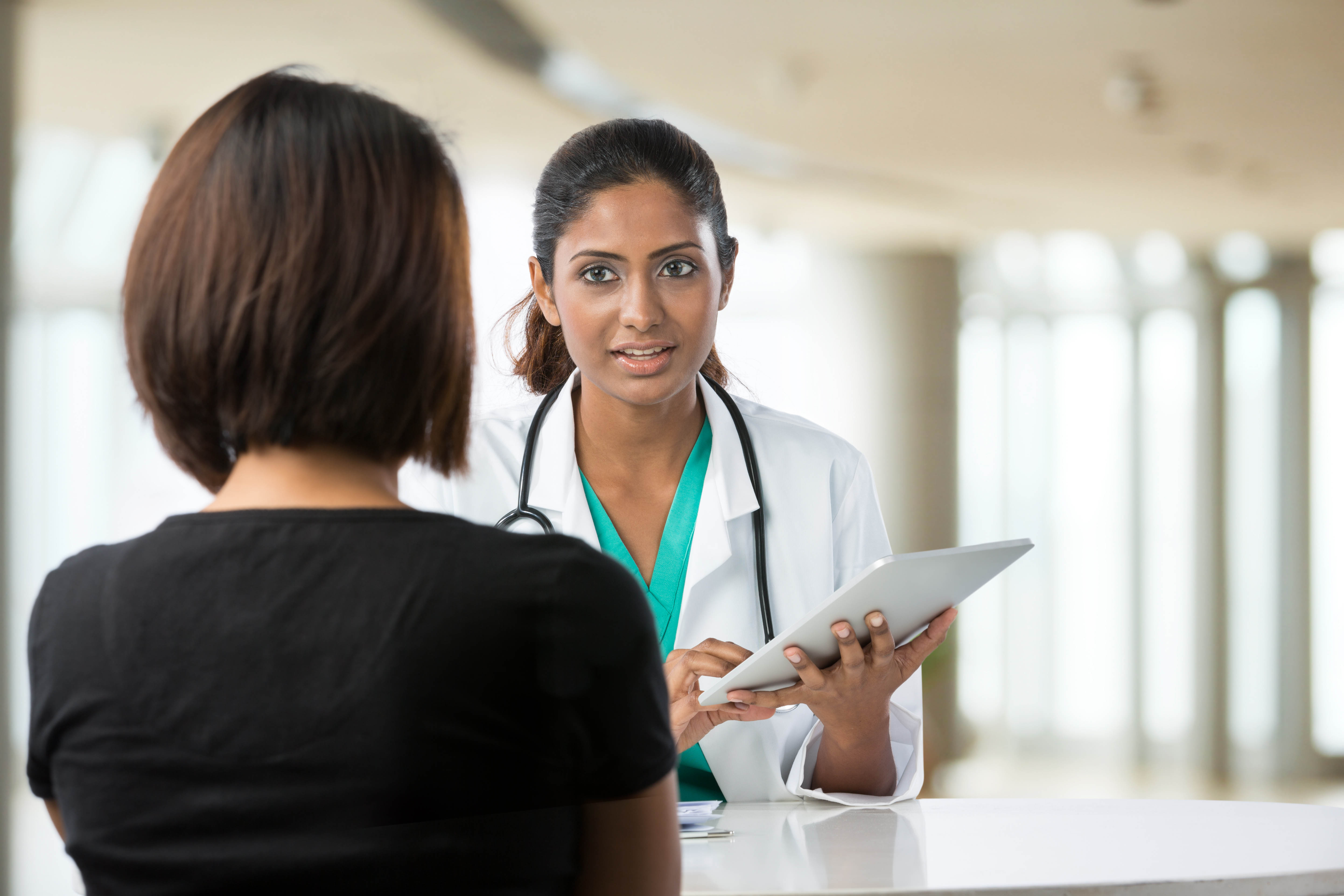 Doctor consulting with patient