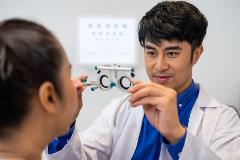 Optometrist helping a customer
