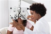 Optometrist with a patient