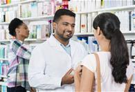 Pharmacist advising a customer