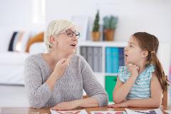 Speech therapist working with a child
