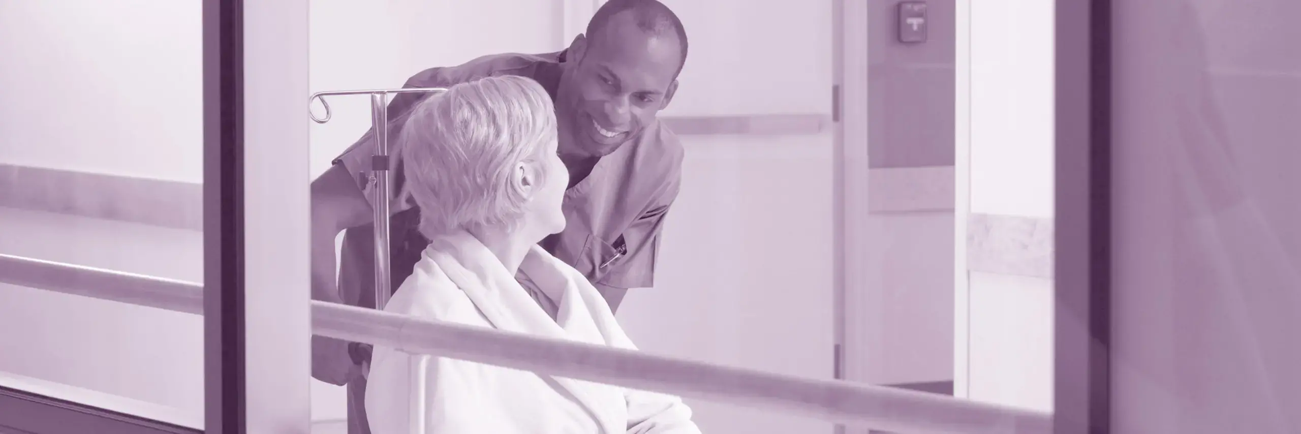 Image showing a nurse talking to a patient in a wheelchair