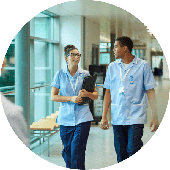 Two healthcare professional walking in a hospital Two healthcare professional walking in a hospital